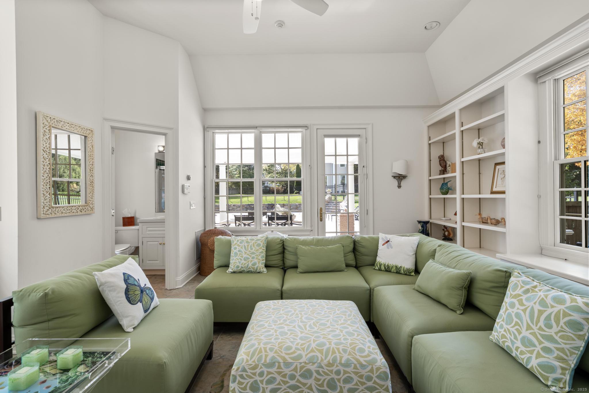 342 Midlock Road Fairfield, CT 06824 - Photo 37 of 40 a living room with furniture and windows