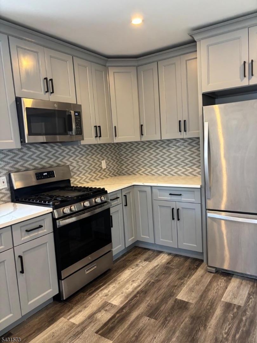 358 Woodland Road, Unit 2 Madison, NJ 07940 - Photo 7 of 50 a kitchen with a stove microwave and refrigerator