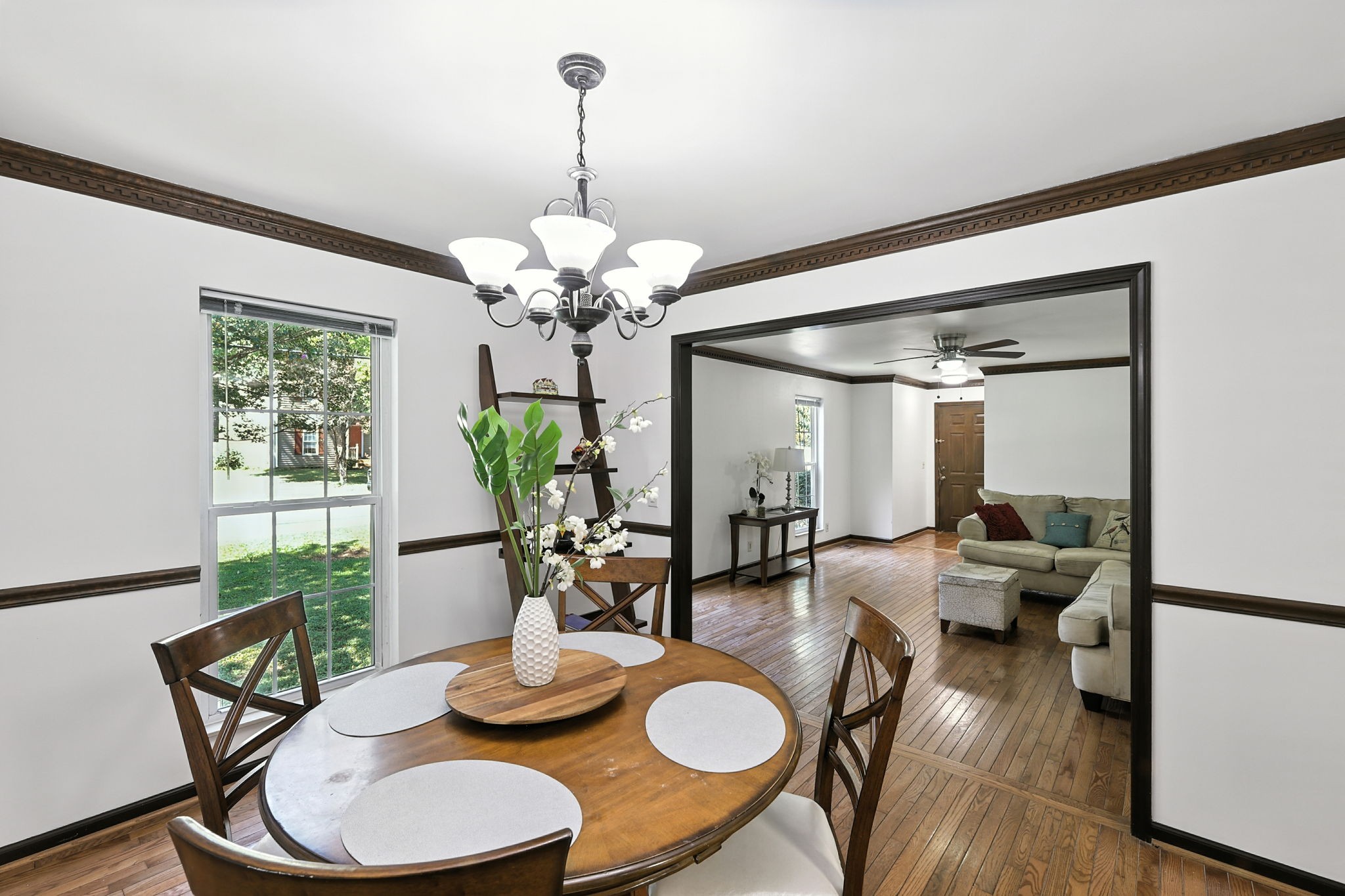 1121 Jacksons Valley Road Hermitage, TN 37076 - Photo 21 of 38 a dining room with furniture a chandelier and wooden floor