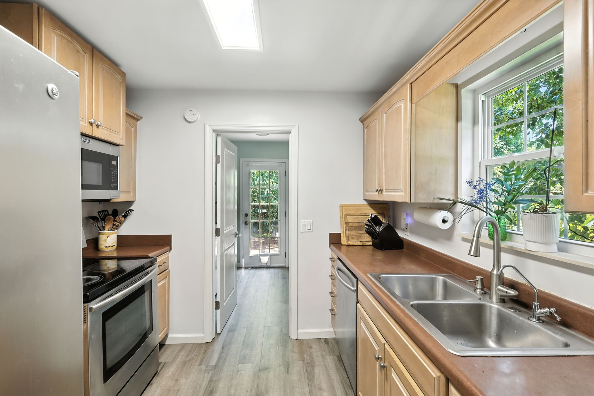 1121 Jacksons Valley Road Hermitage, TN 37076 - Photo 22 of 38 a kitchen with a sink stove top oven and refrigerator