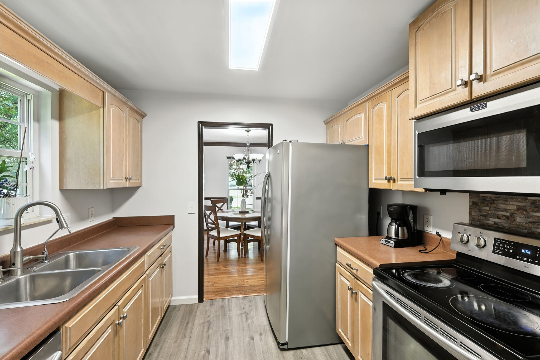 1121 Jacksons Valley Road Hermitage, TN 37076 - Photo 23 of 38 a kitchen with stainless steel appliances a stove a sink and a microwave