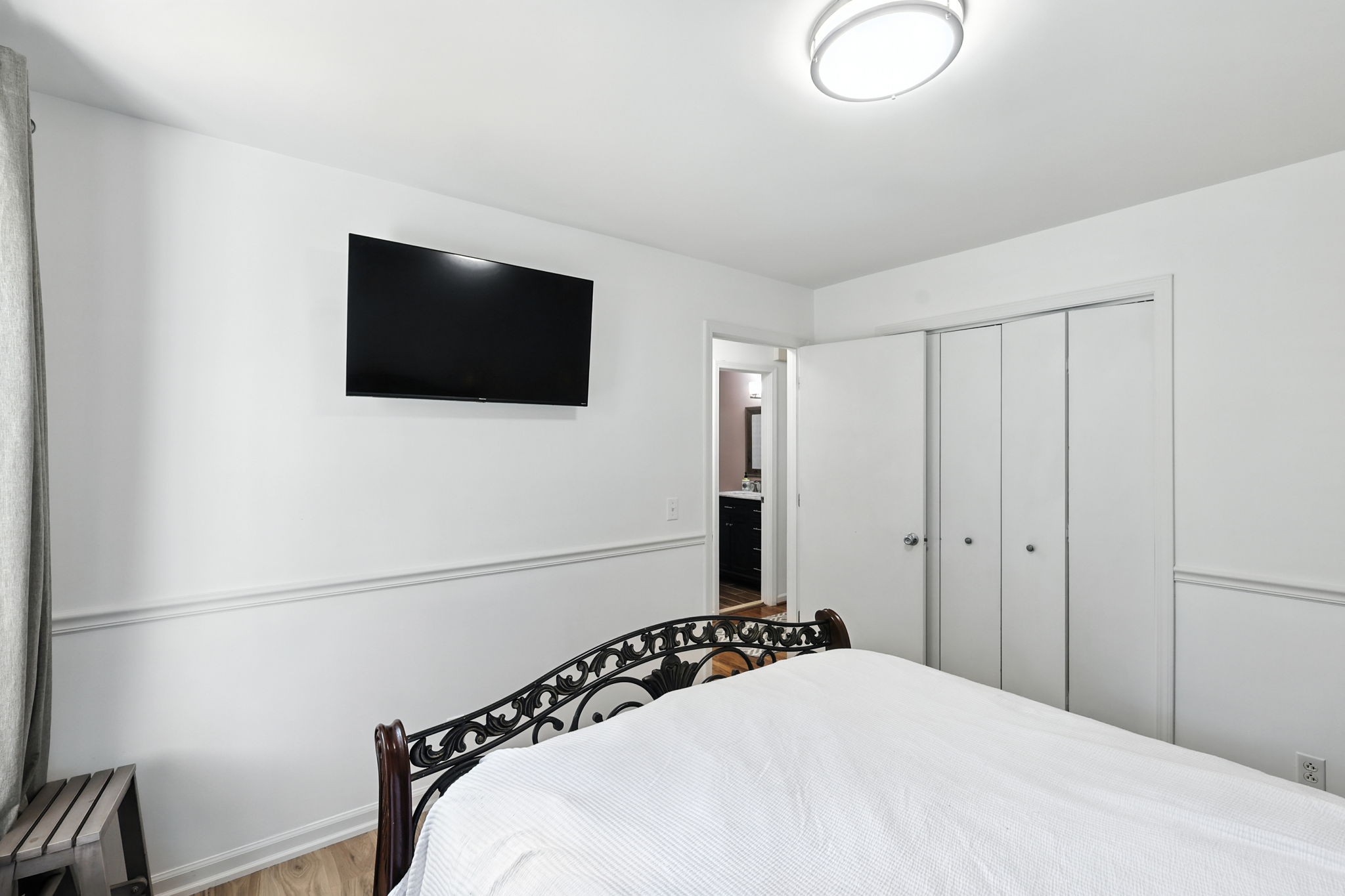 1121 Jacksons Valley Road Hermitage, TN 37076 - Photo 26 of 38 a bedroom with a bed and a flat screen tv