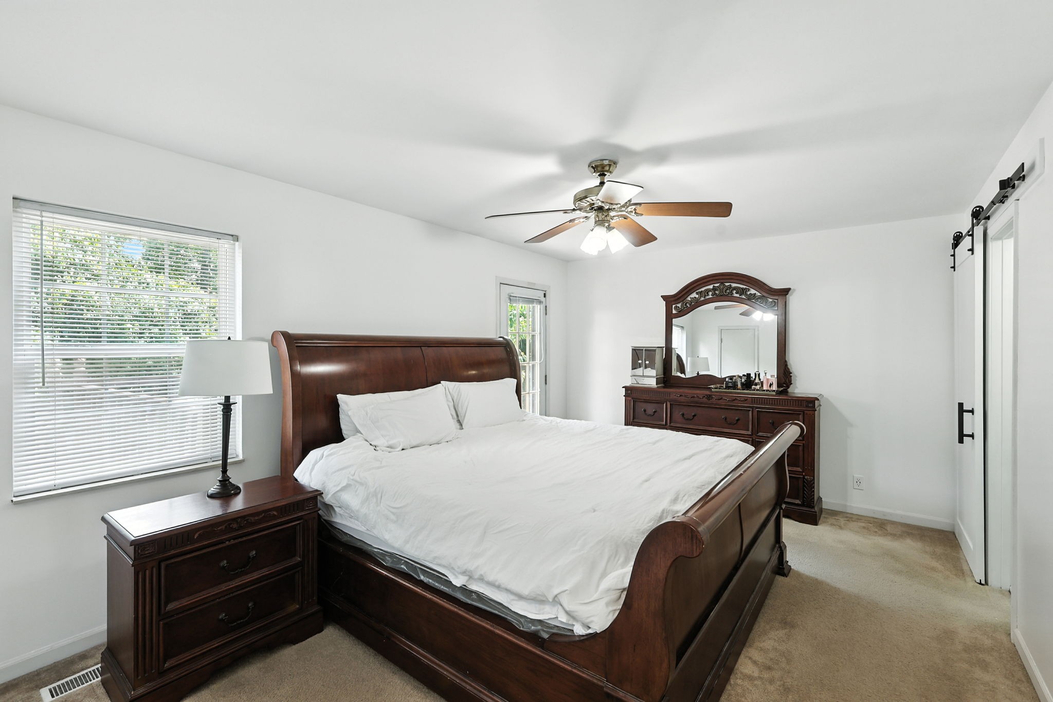 1121 Jacksons Valley Road Hermitage, TN 37076 - Photo 30 of 38 a bedroom with a bed and a dresser with mirror