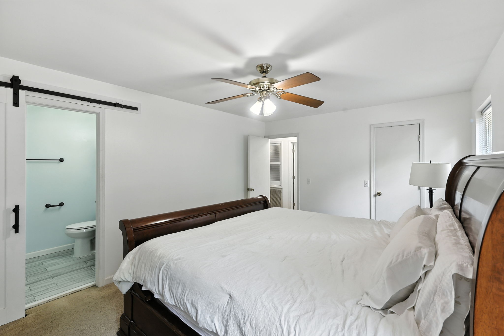 1121 Jacksons Valley Road Hermitage, TN 37076 - Photo 32 of 38 a bedroom with a bed and a chandelier