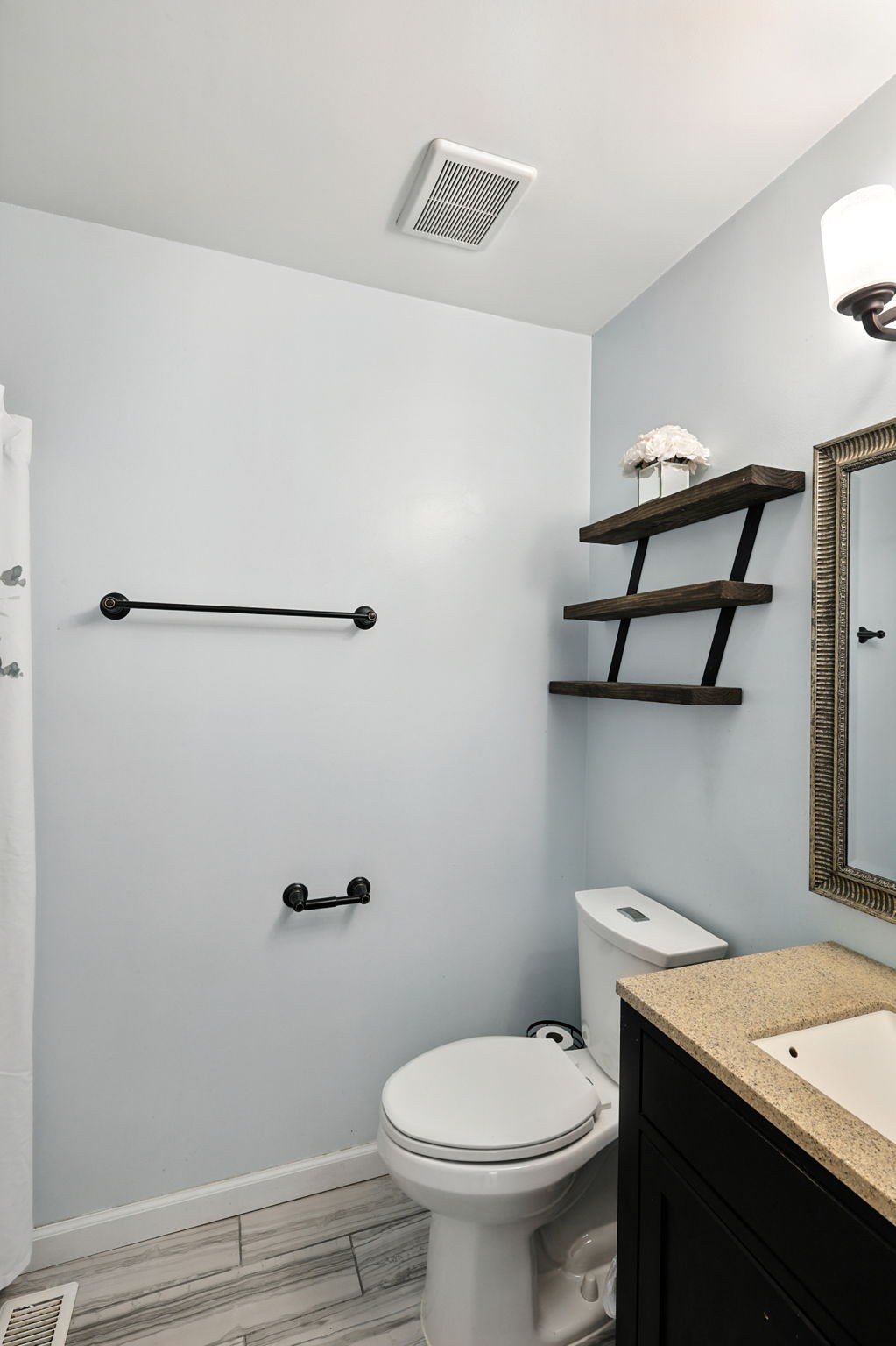 1121 Jacksons Valley Road Hermitage, TN 37076 - Photo 36 of 38 a bathroom with a granite countertop sink mirror vanity and toilet