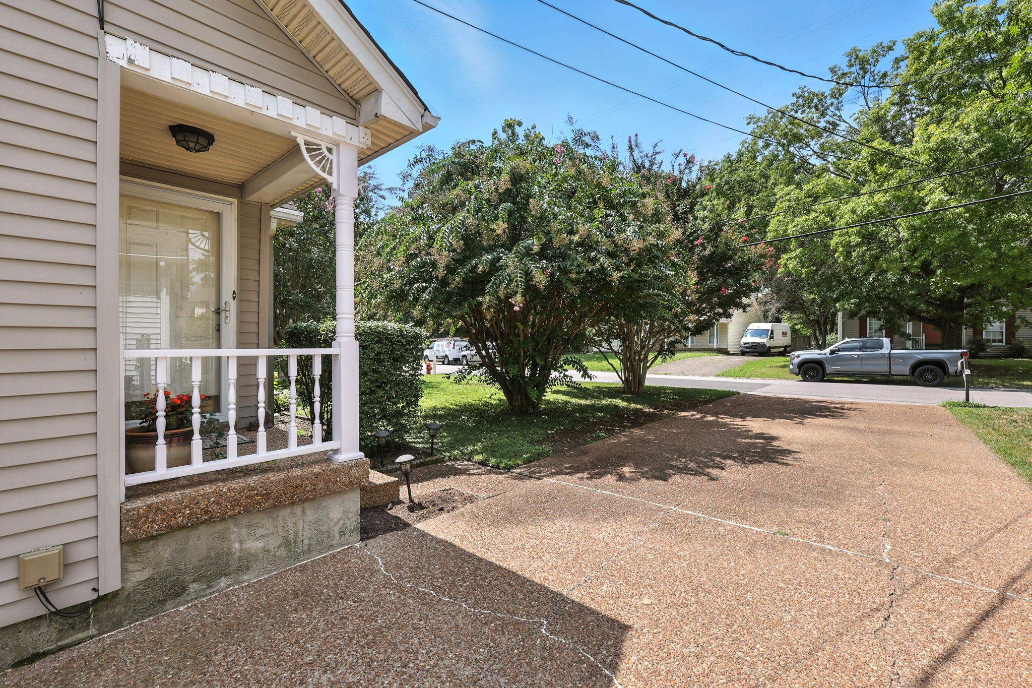 1121 Jacksons Valley Road Hermitage, TN 37076 - Photo 6 of 38 a view of a brick house with a large windows and a table and chairs