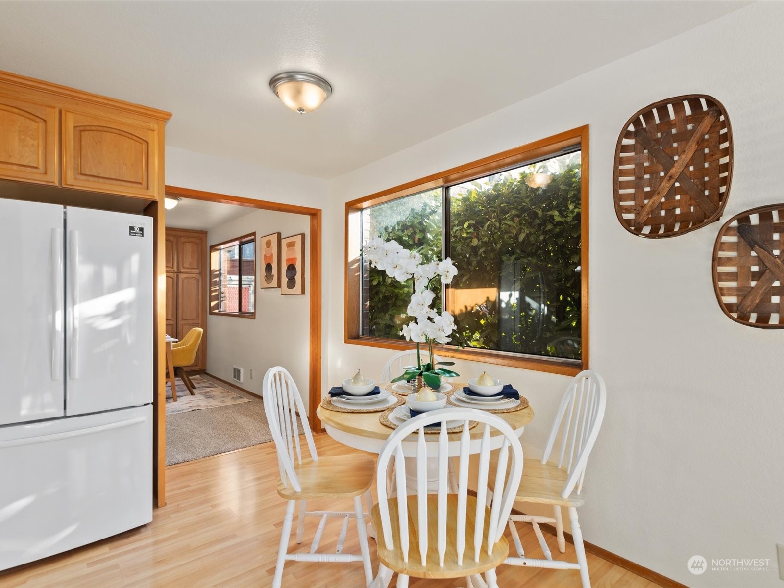 2619 Rucker Avenue, Unit 2 Everett, WA 98201 - Photo 19 of 39 a view of a dining room with furniture wooden floor and a chandelier