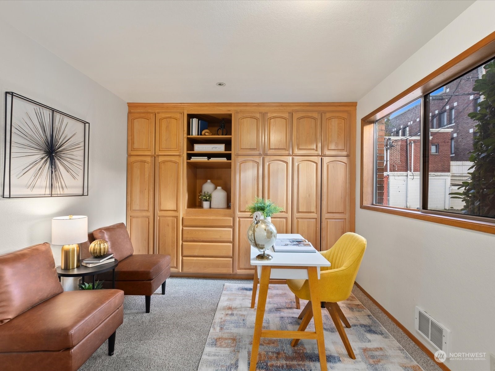 2619 Rucker Avenue, Unit 2 Everett, WA 98201 - Photo 20 of 39 a living room with furniture a window and a flat screen tv