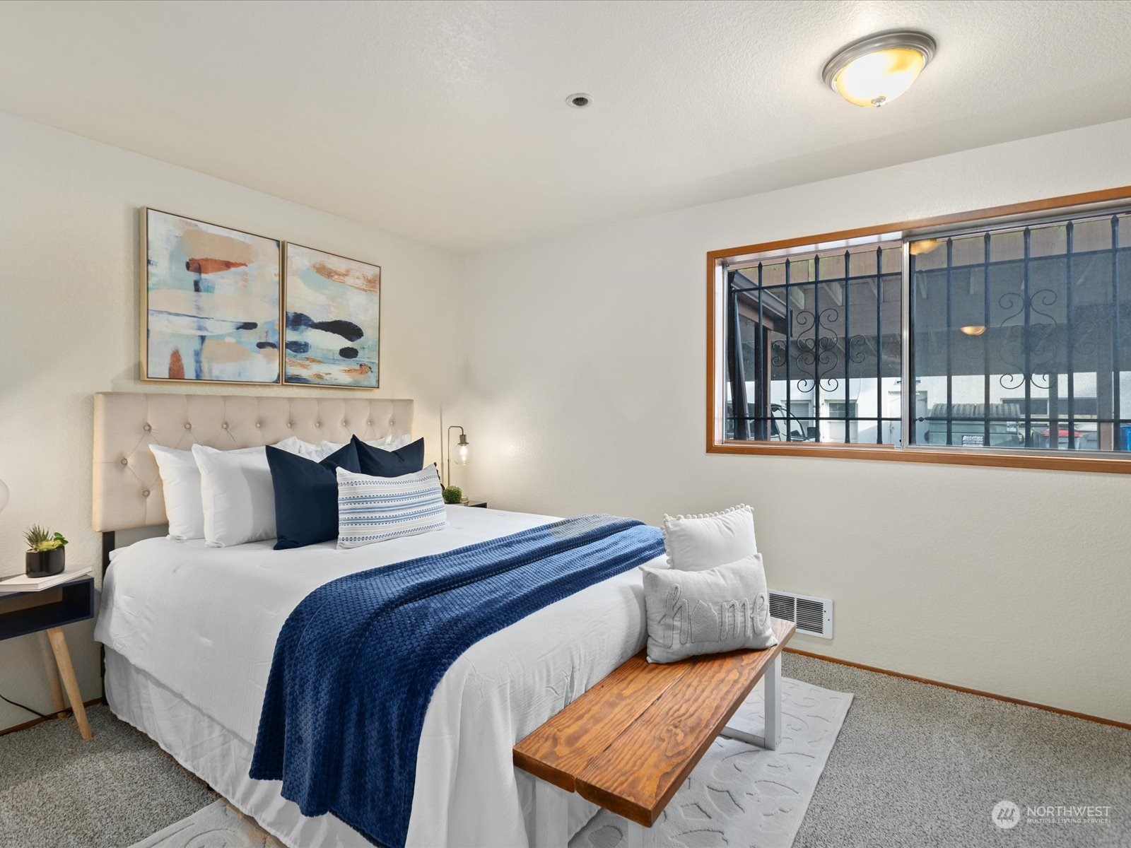 2619 Rucker Avenue, Unit 2 Everett, WA 98201 - Photo 24 of 39 a bedroom with a bed and a window