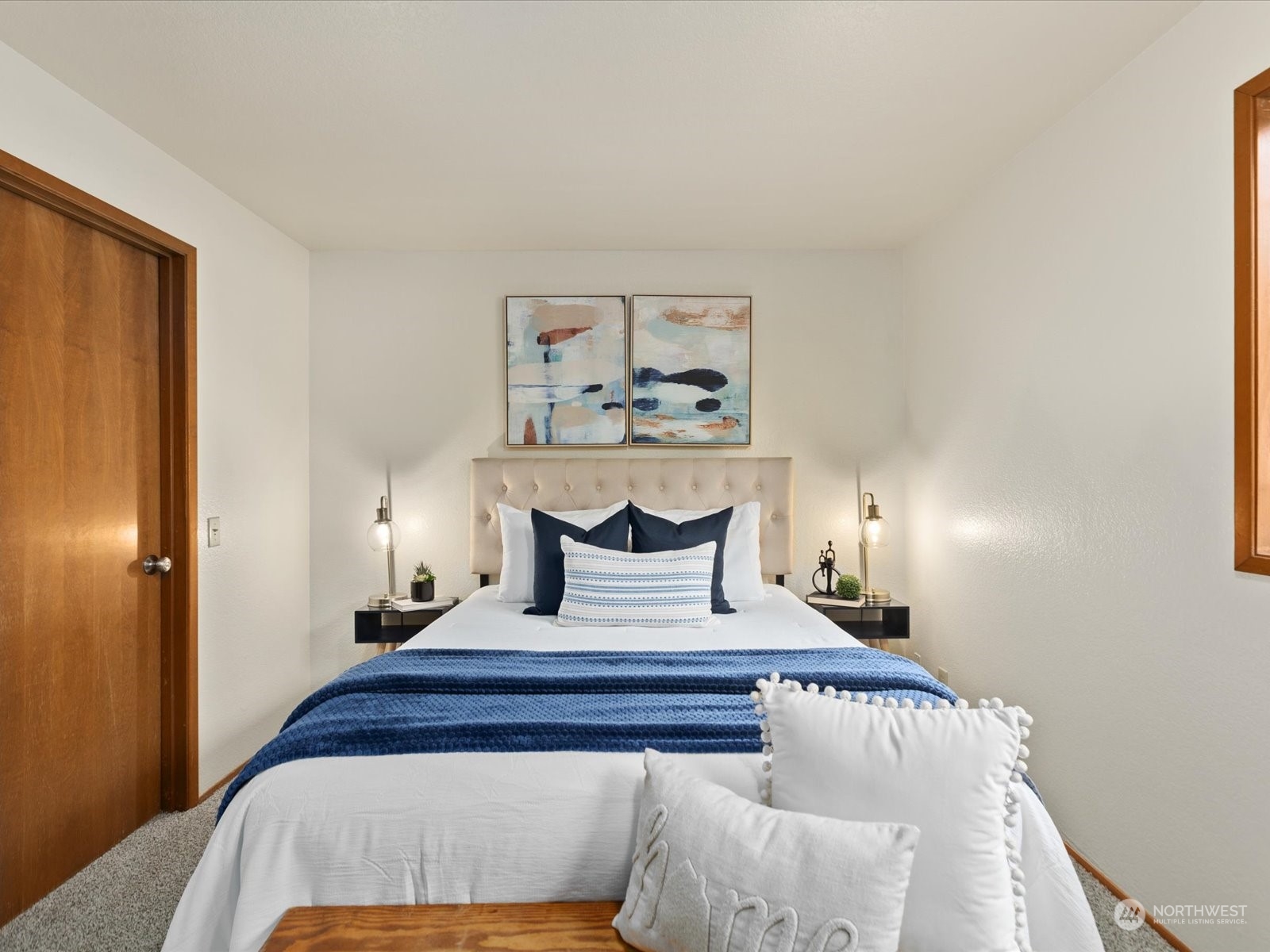 2619 Rucker Avenue, Unit 2 Everett, WA 98201 - Photo 25 of 39 a bedroom with a bed and a painting on the wall