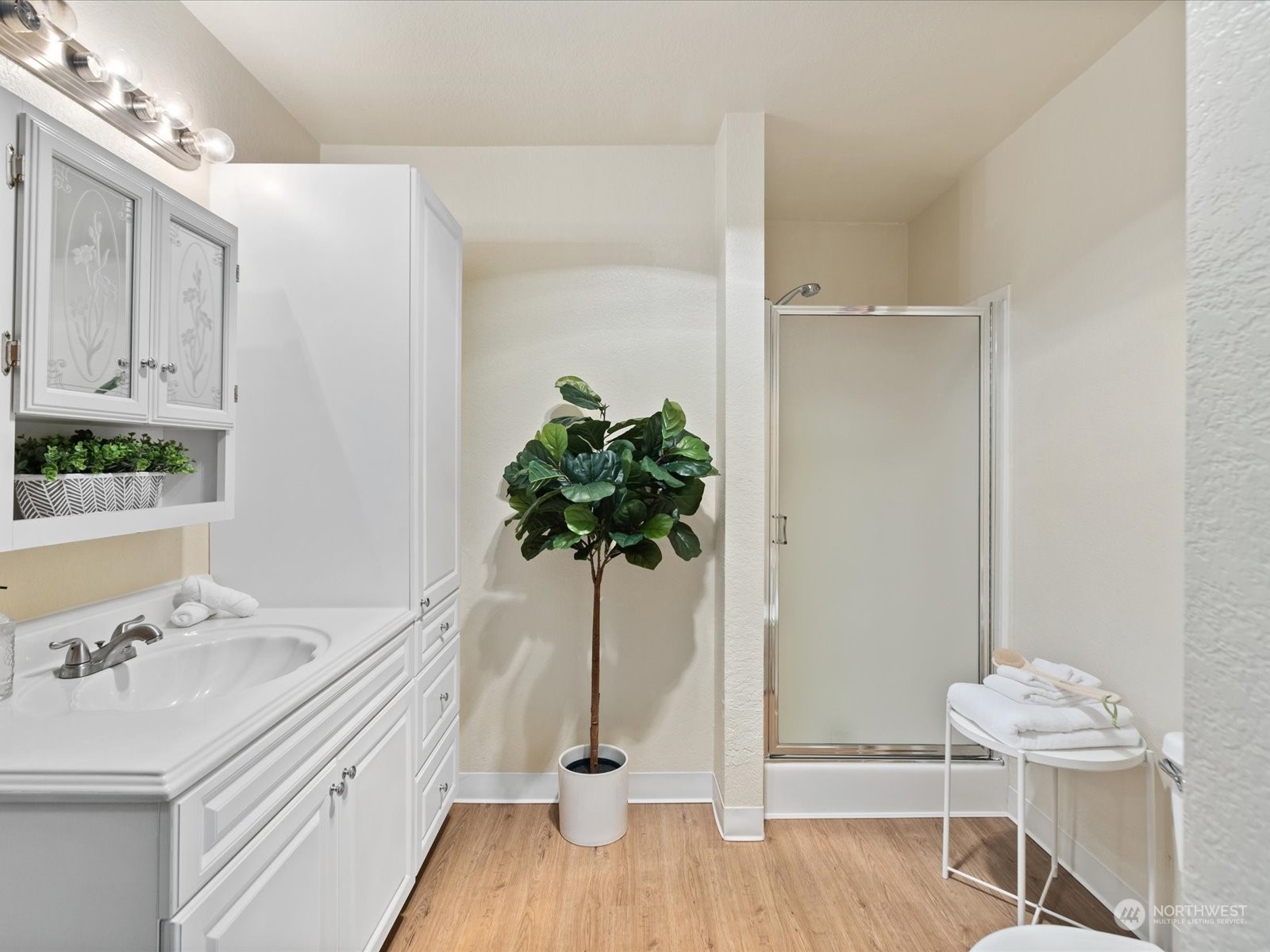 2619 Rucker Avenue, Unit 2 Everett, WA 98201 - Photo 27 of 39 a bathroom with a sink a potted plant and a window