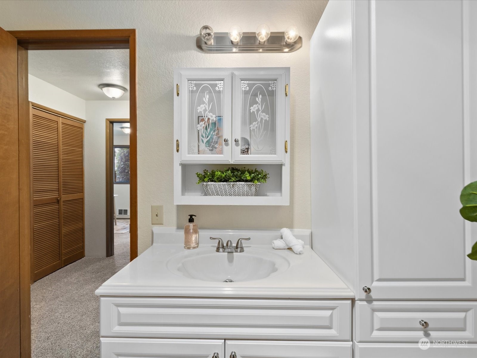 2619 Rucker Avenue, Unit 2 Everett, WA 98201 - Photo 29 of 39 a bathroom with a sink and a mirror