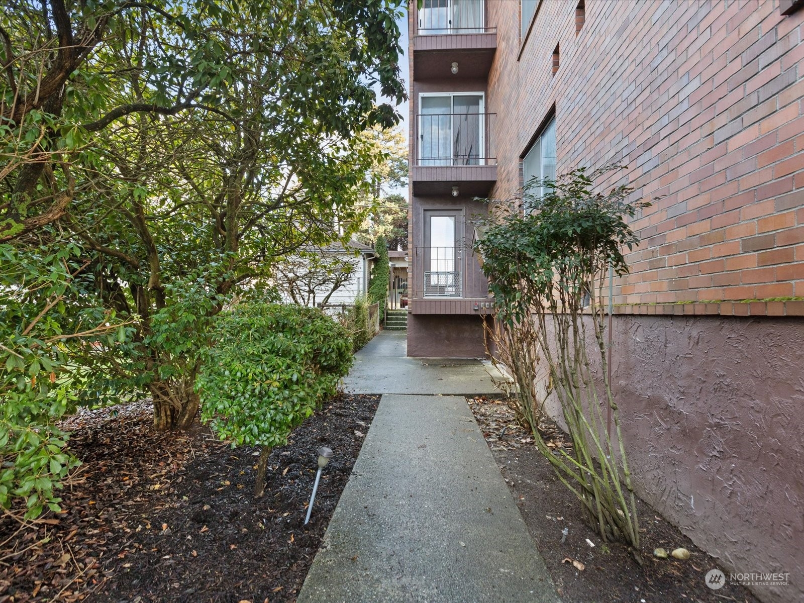 2619 Rucker Avenue, Unit 2 Everett, WA 98201 - Photo 6 of 39 a view of a pathway with a house