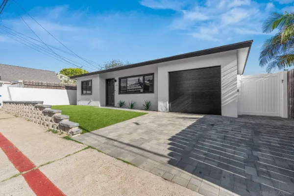 a front view of a house with a garage