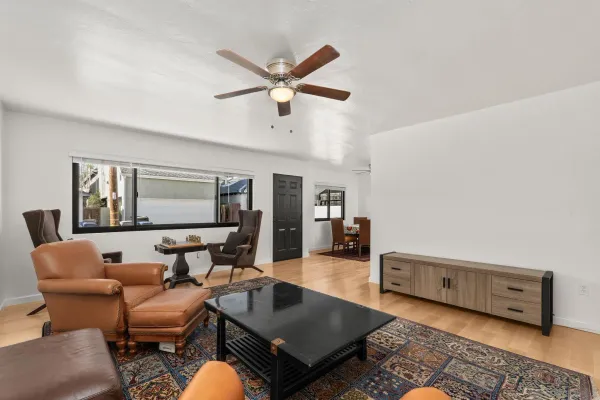 a view of a big room with windows and closet