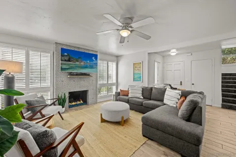a living room with furniture and a fireplace