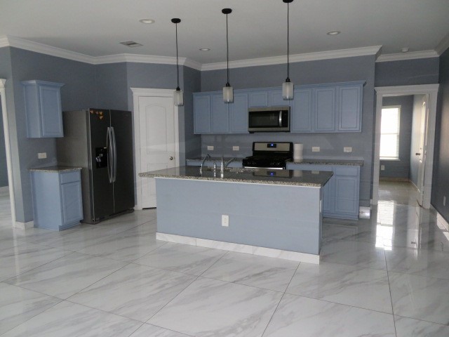 23210 Barberry Crk Trail Spring, TX 77373 - Photo 32 of 33 a kitchen with stainless steel appliances granite countertop a refrigerator a sink a stove and microwave