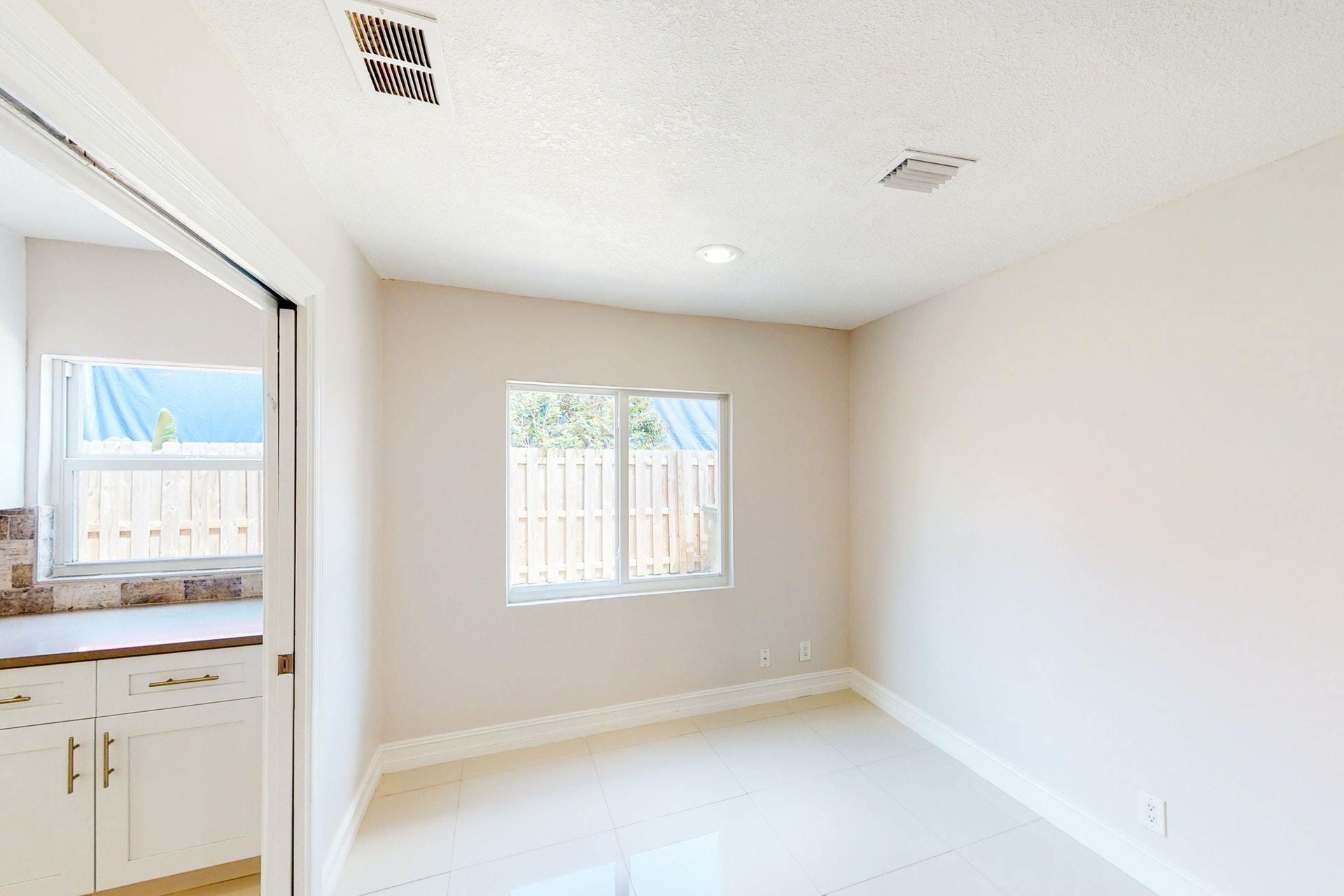 1339 Southwest 3rd Street Boca Raton, FL 33486 - Photo 17 of 56 a view of an empty room with a window