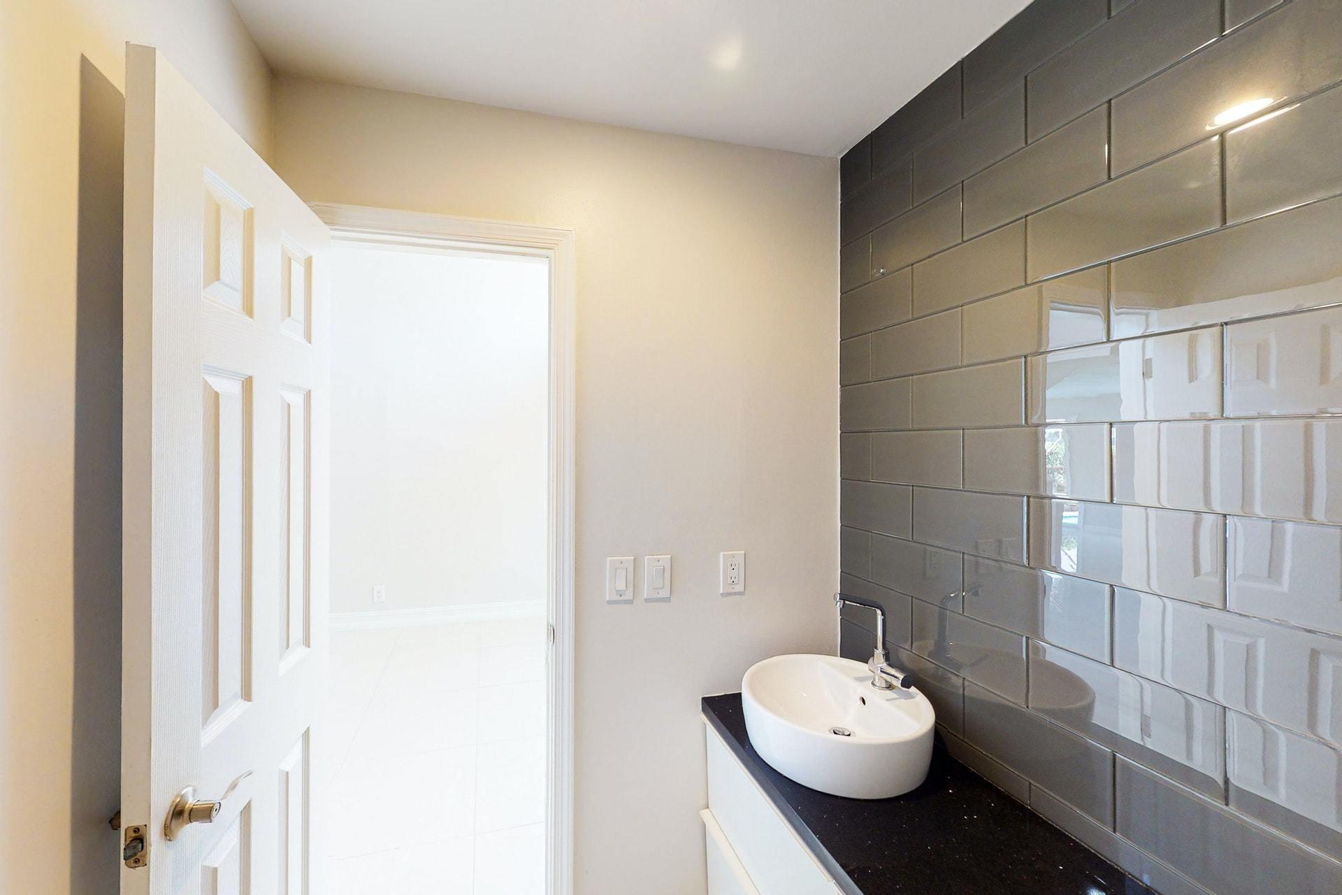 1339 Southwest 3rd Street Boca Raton, FL 33486 - Photo 20 of 56 a bathroom with a toilet sink and mirror