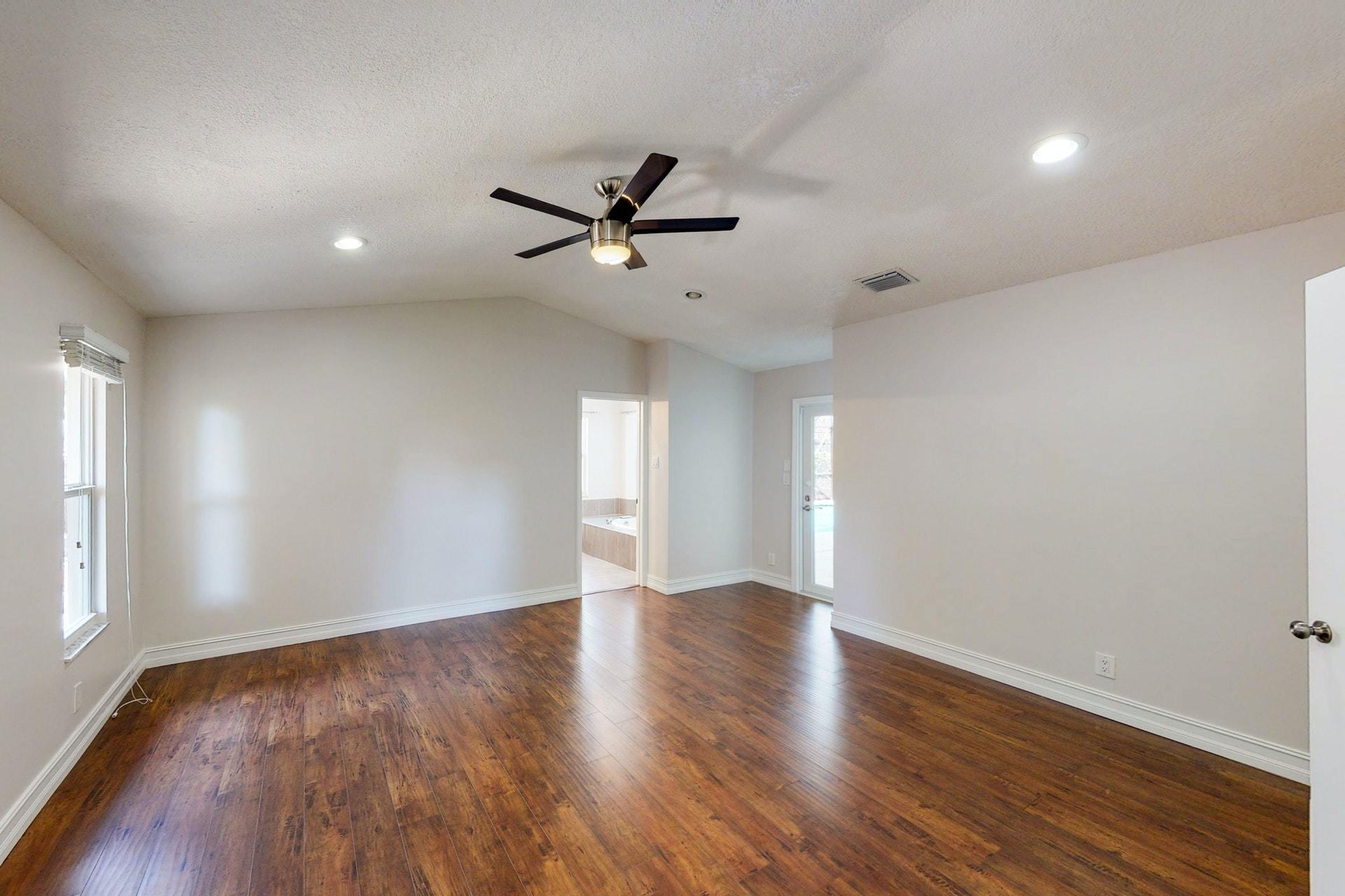 1339 Southwest 3rd Street Boca Raton, FL 33486 - Photo 24 of 56 a view of an empty room with a window and wooden floor
