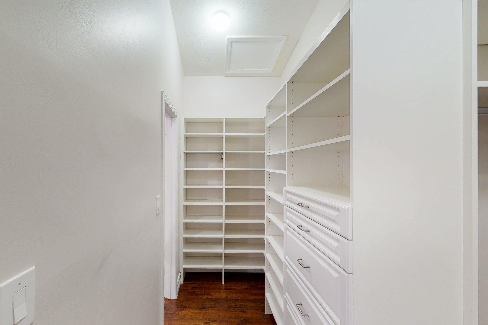 1339 Southwest 3rd Street Boca Raton, FL 33486 - Photo 25 of 56 a view of walk in closet with empty racks