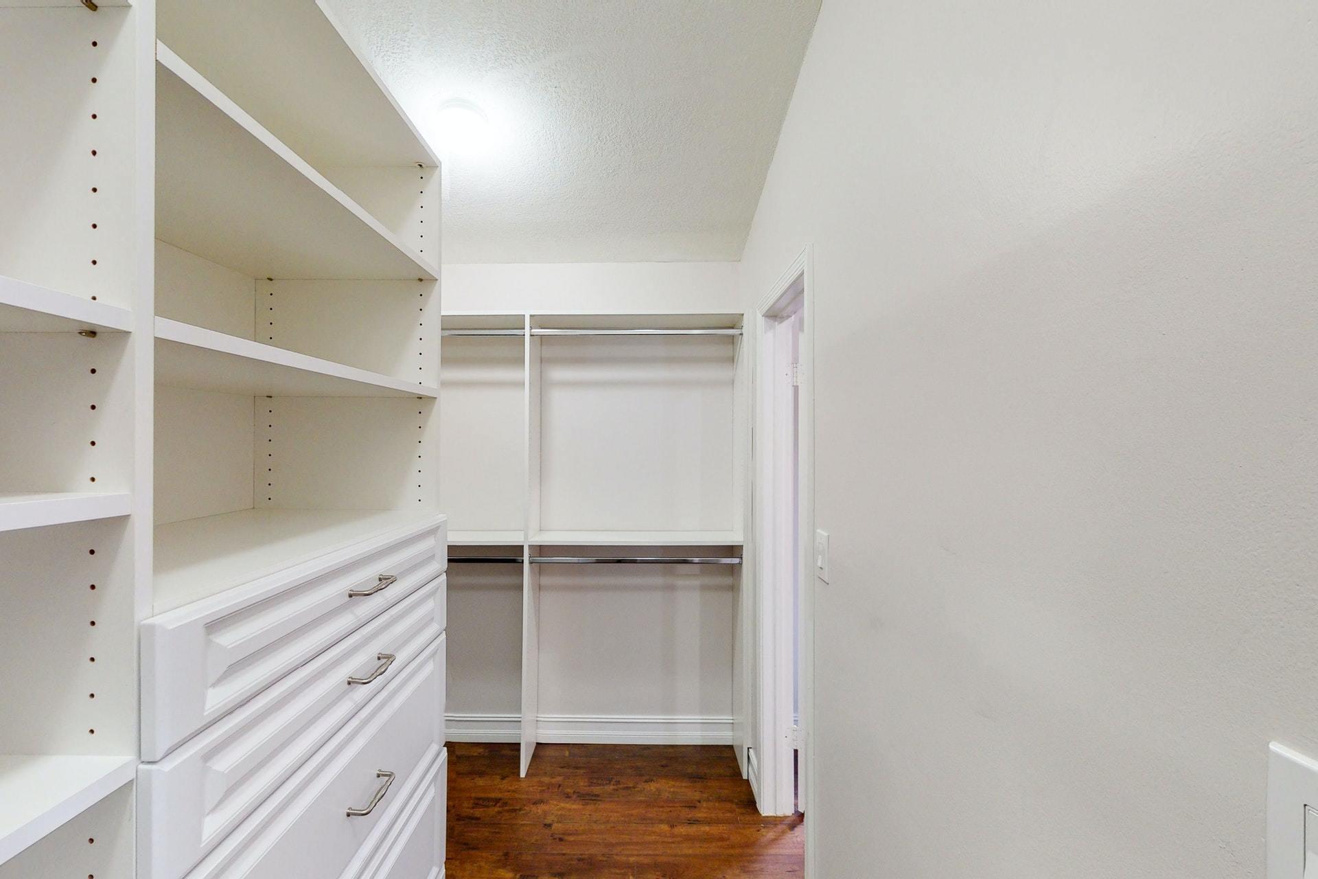 1339 Southwest 3rd Street Boca Raton, FL 33486 - Photo 26 of 56 a view of walk in closet with empty racks