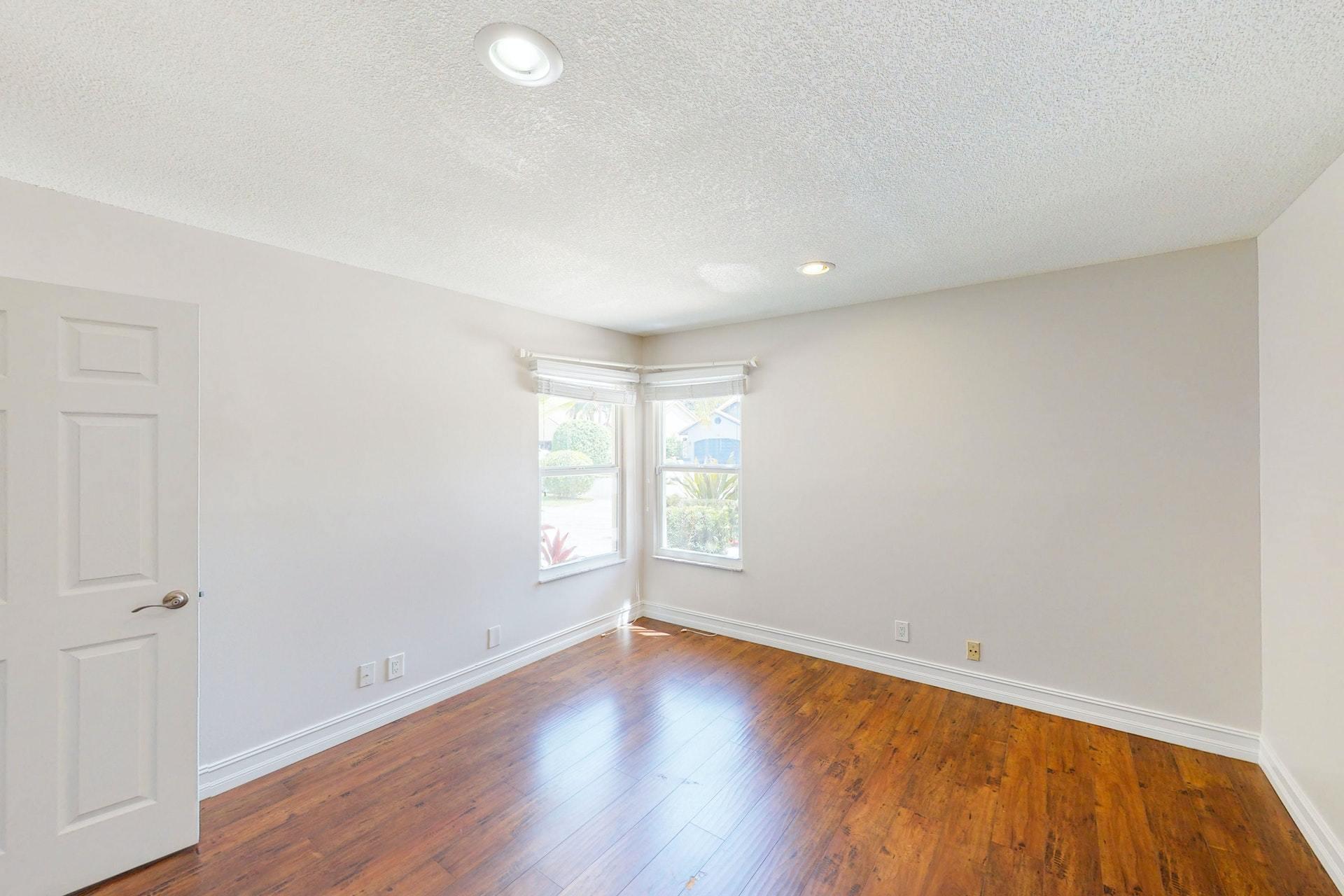 1339 Southwest 3rd Street Boca Raton, FL 33486 - Photo 32 of 56 an empty room with wooden floor and windows