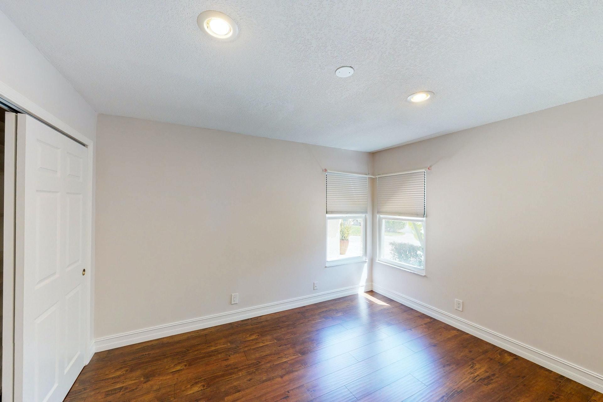 1339 Southwest 3rd Street Boca Raton, FL 33486 - Photo 34 of 56 an empty room with wooden floor and windows