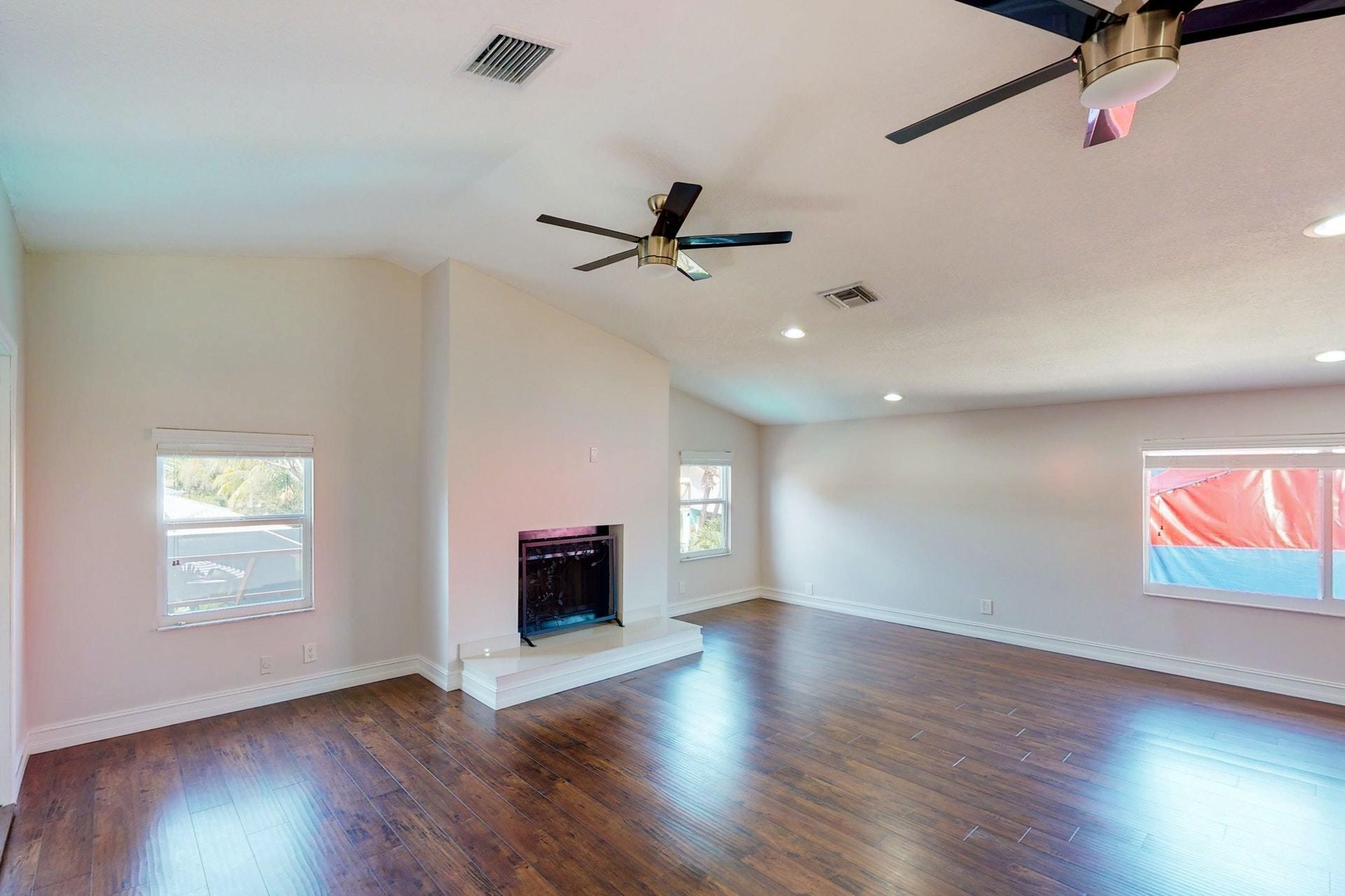 1339 Southwest 3rd Street Boca Raton, FL 33486 - Photo 36 of 56 wooden floor in an empty room with a window