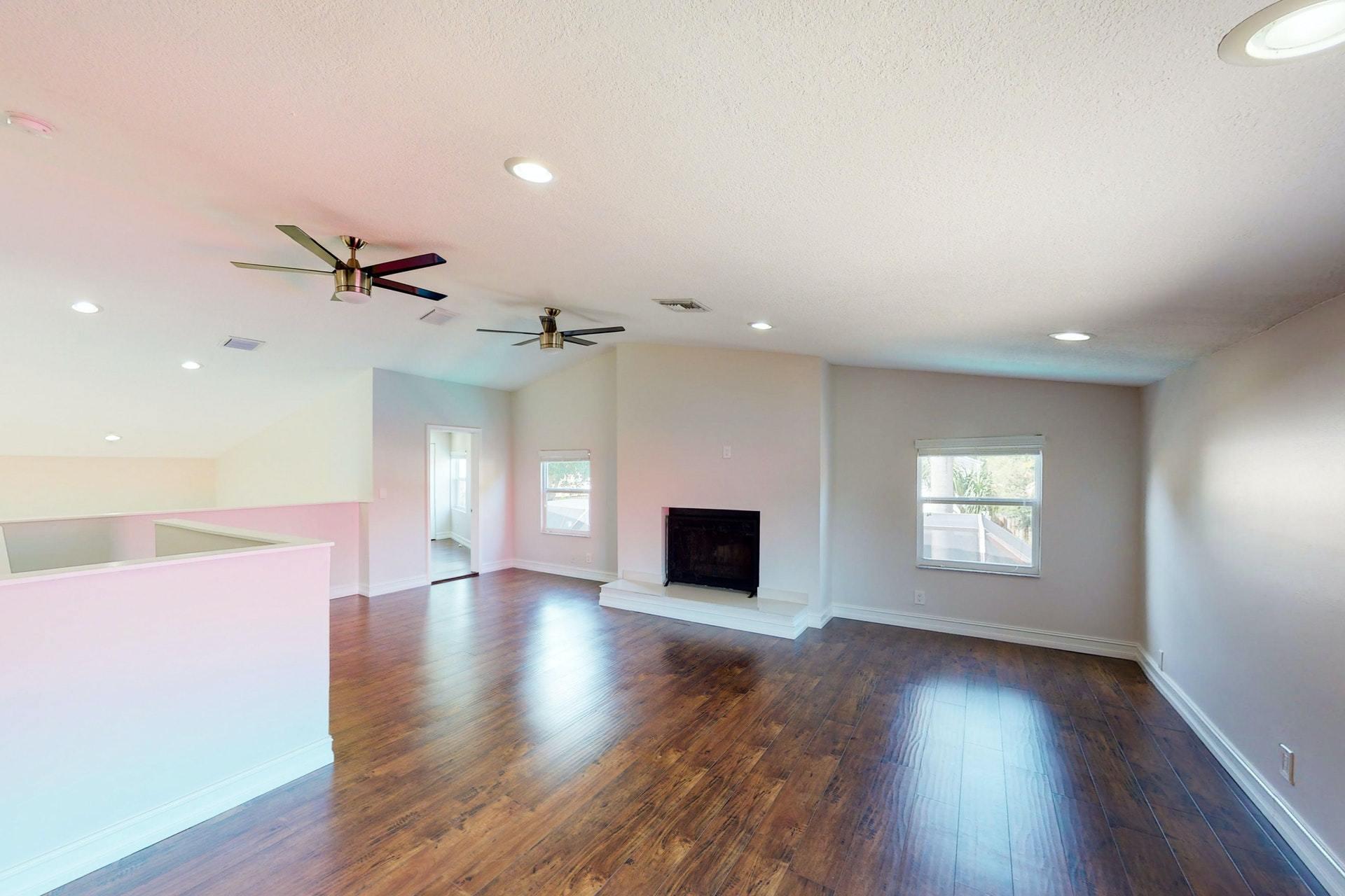 1339 Southwest 3rd Street Boca Raton, FL 33486 - Photo 38 of 56 a view of an empty room with a window and wooden floor