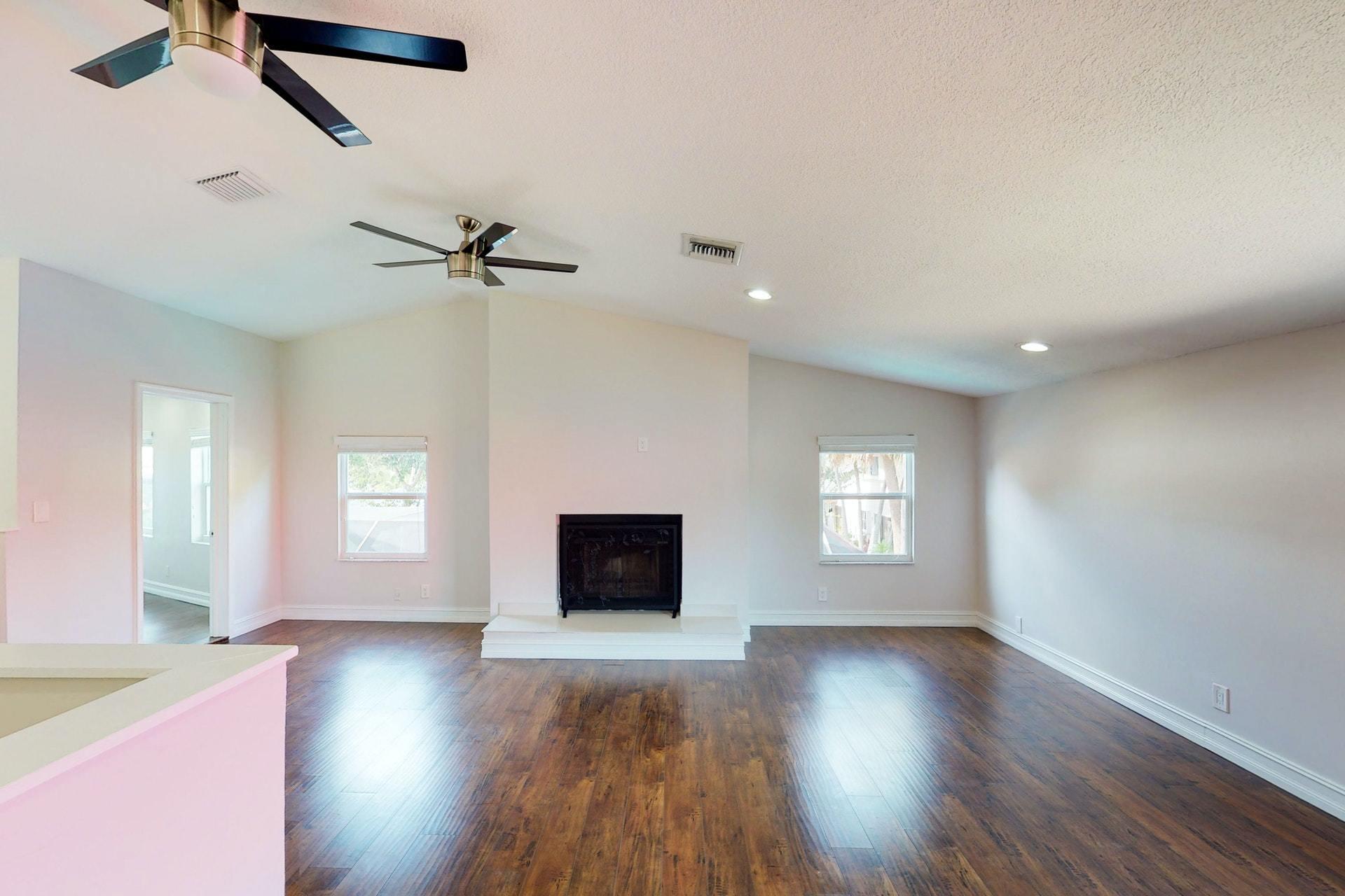 1339 Southwest 3rd Street Boca Raton, FL 33486 - Photo 39 of 56 a view of an empty room with window and wooden floor