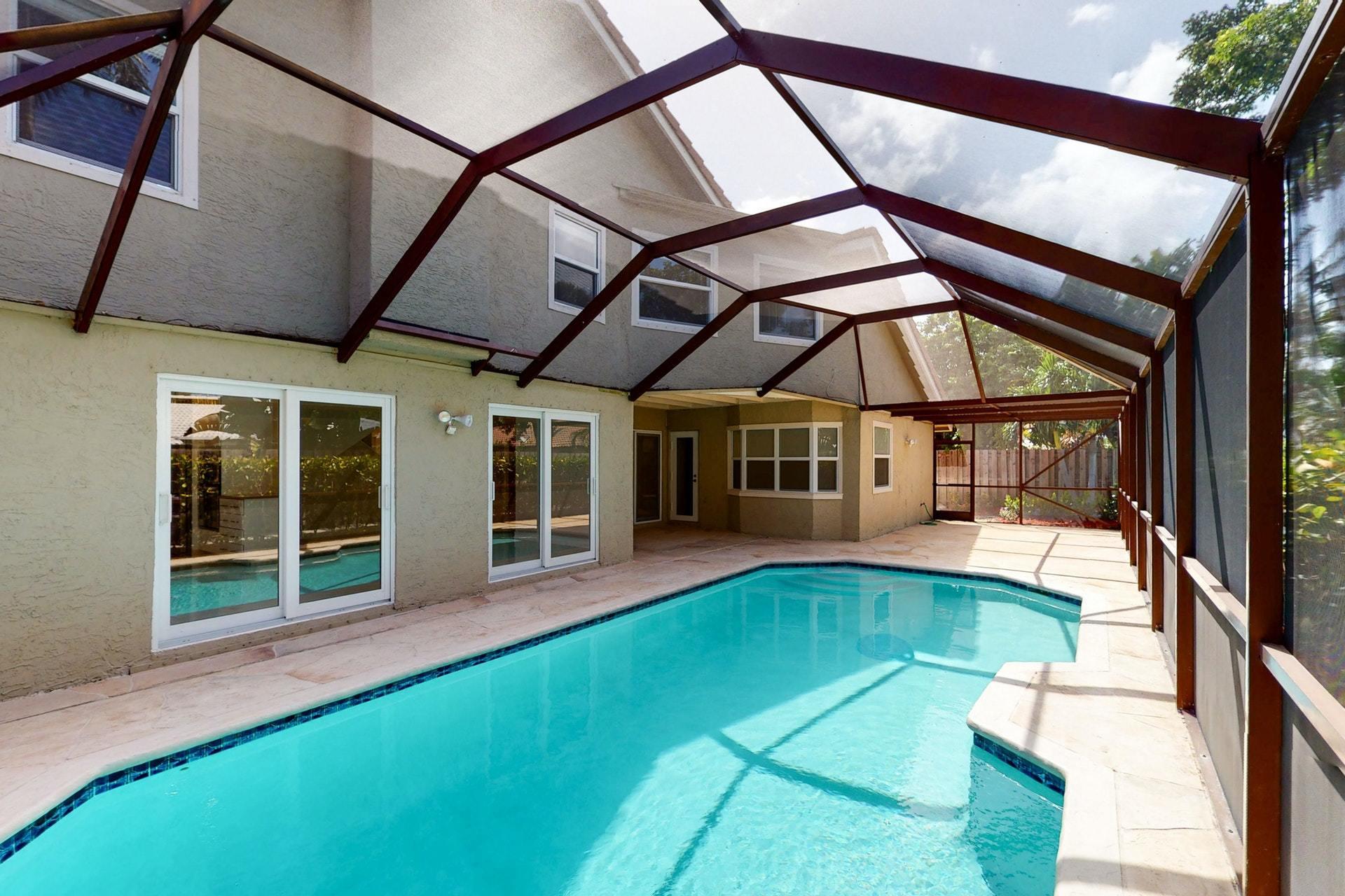 1339 Southwest 3rd Street Boca Raton, FL 33486 - Photo 51 of 56 a view of a house with pool and sitting area