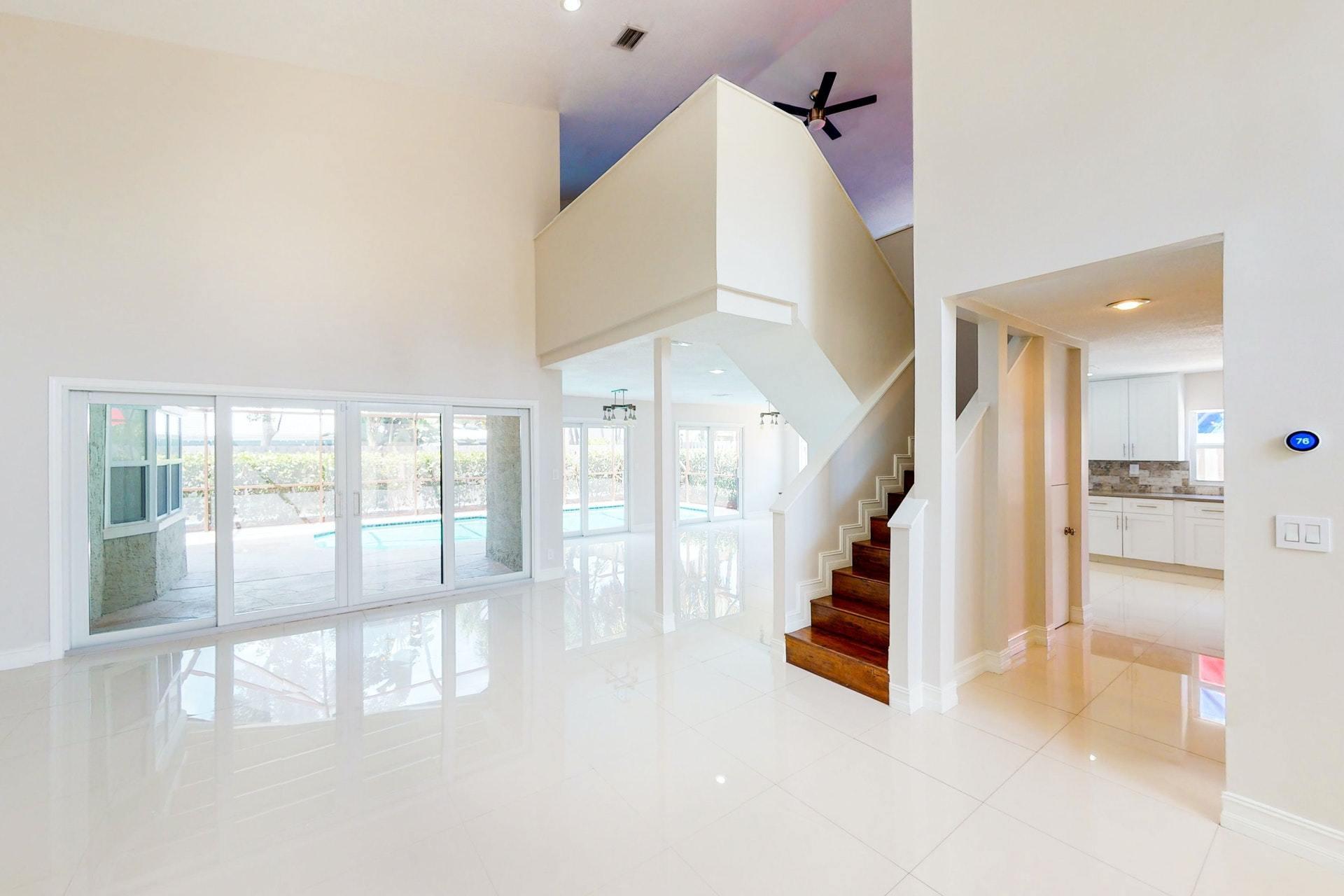 1339 Southwest 3rd Street Boca Raton, FL 33486 - Photo 7 of 56 a view of entryway and hall with wooden floor