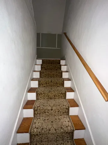 a view of entryway with stairs