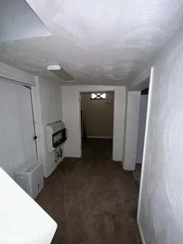 a view of a storage & utility room with a sink