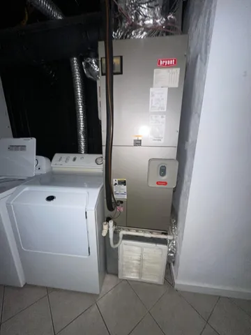 a utility room with dryer and washer