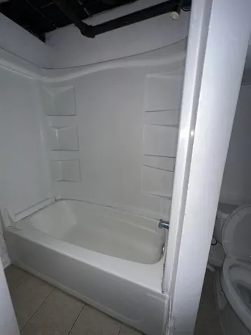 a close view of a bathtub in bathroom