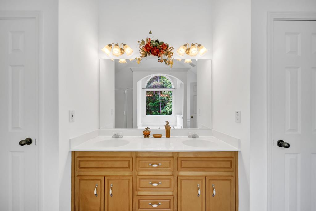 750 Cable Road Waleska, GA 30183 - Photo 12 of 33 a bathroom with a sink mirror and window