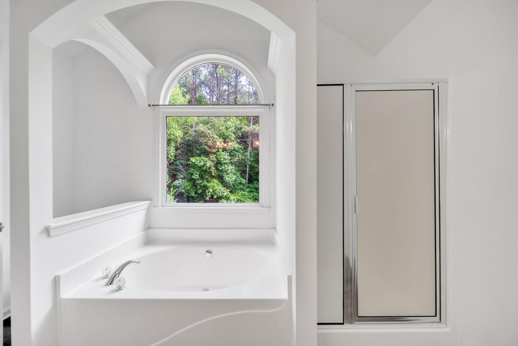 750 Cable Road Waleska, GA 30183 - Photo 13 of 33 a bathroom with a bathtub and window