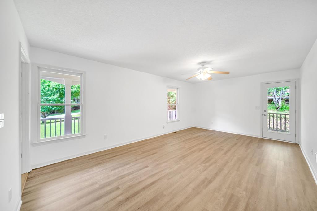 750 Cable Road Waleska, GA 30183 - Photo 17 of 33 a view of an empty room with wooden floor and a window