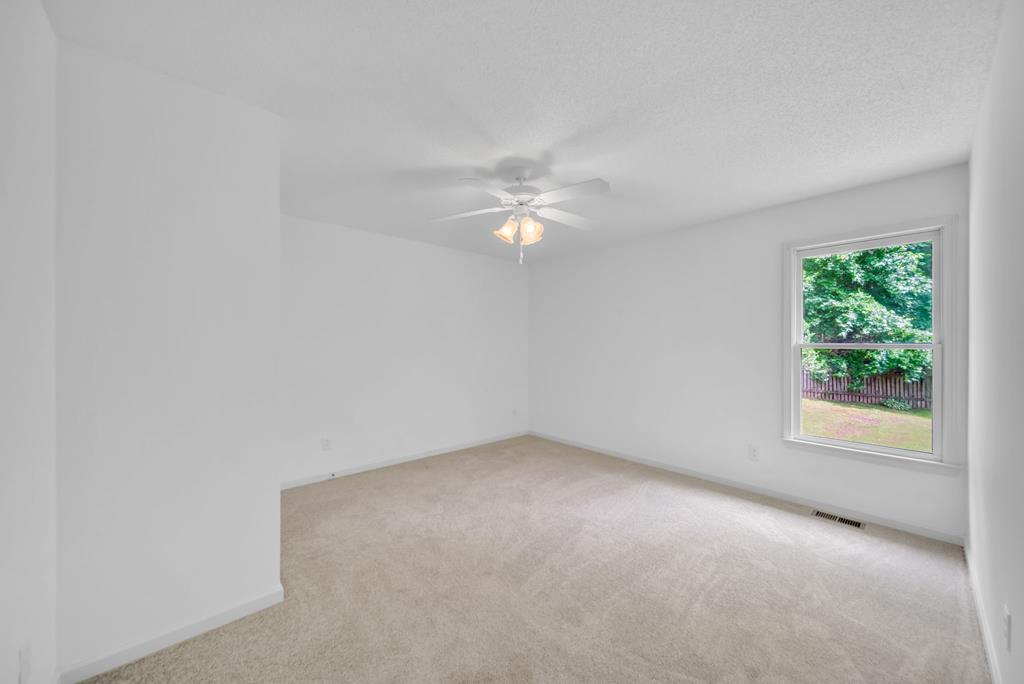 750 Cable Road Waleska, GA 30183 - Photo 18 of 33 an empty room with a window