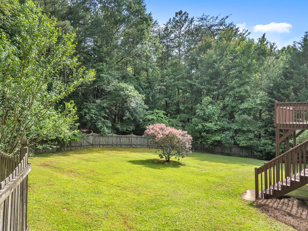 750 Cable Road Waleska, GA 30183 - Photo 24 of 33 a view of a swimming pool with an outdoor space and seating area