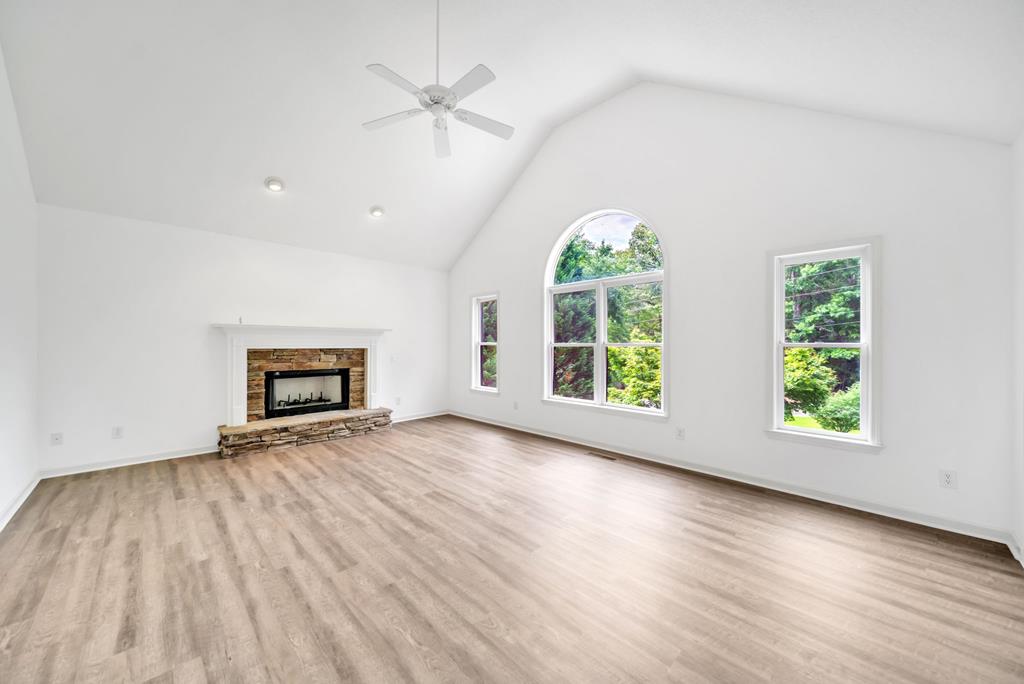 750 Cable Road Waleska, GA 30183 - Photo 3 of 33 a view of an empty room with a window and wooden floor