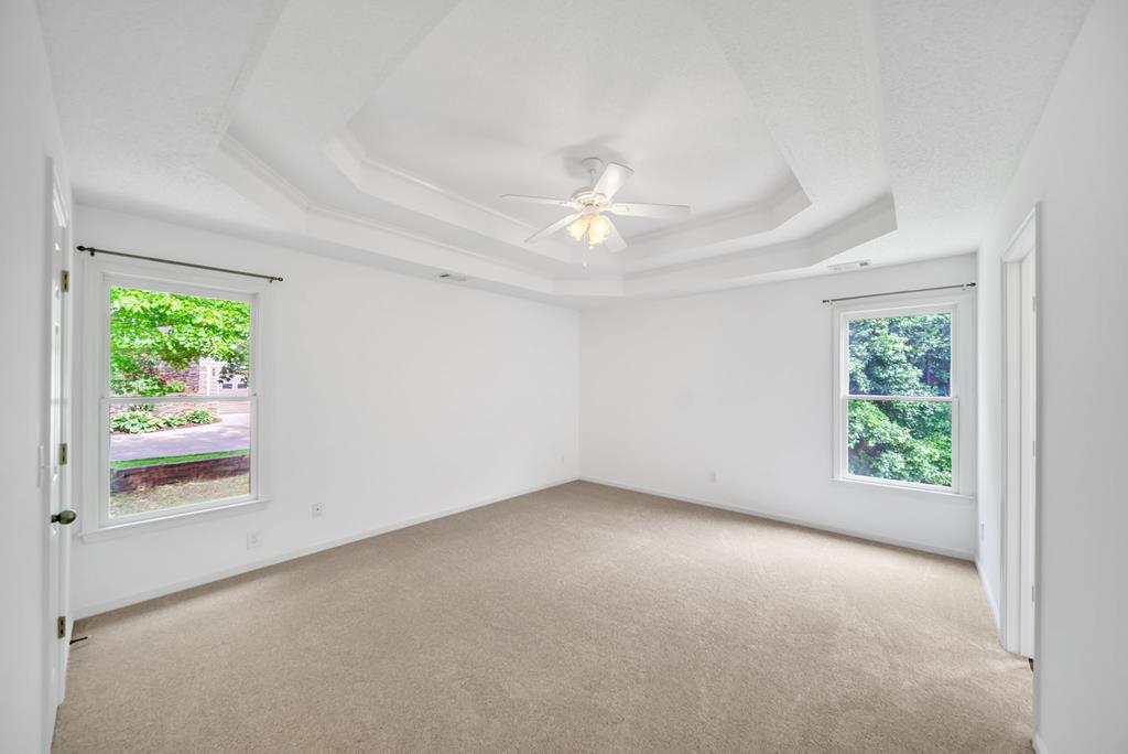 750 Cable Road Waleska, GA 30183 - Photo 5 of 33 an empty room with windows and closet