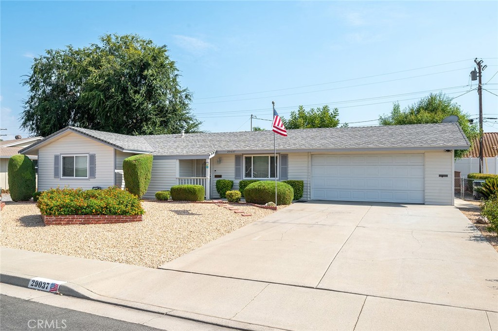 29037 Prestwick Road Menifee, CA 92586 - Photo 1 of 1 a front view of a house with a yard and potted plants
