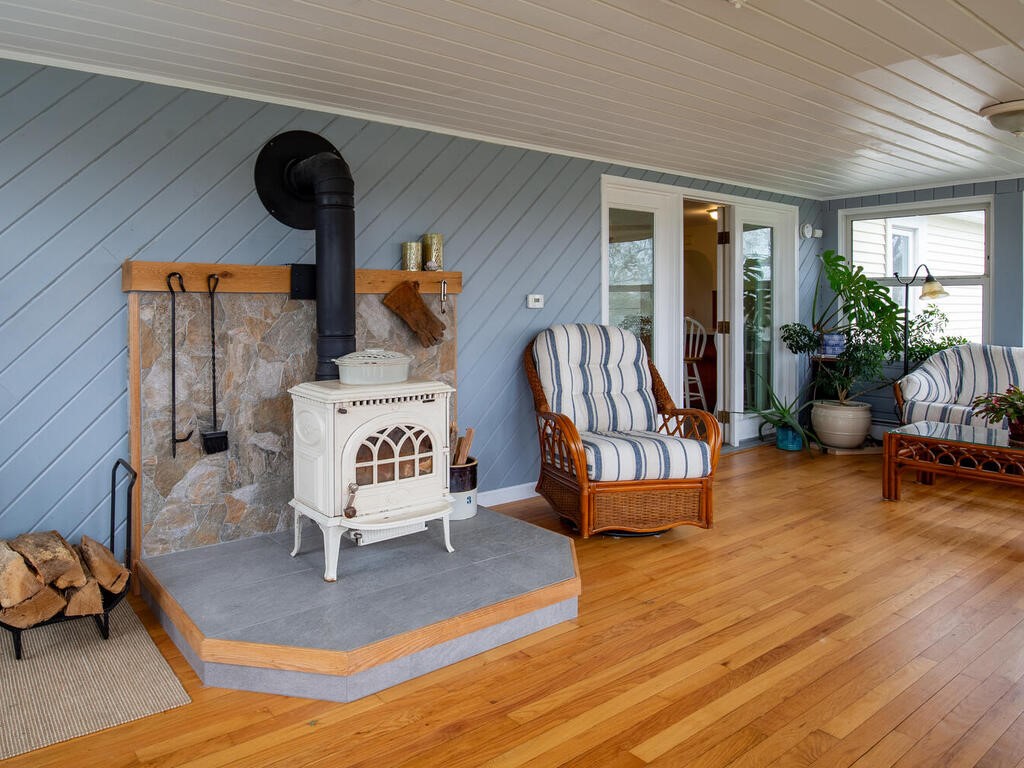 2 Thompson Avenue Westerly, RI 02891 - Photo 12 of 36 The wood stove ensures that this room is comfortable during the cold months.