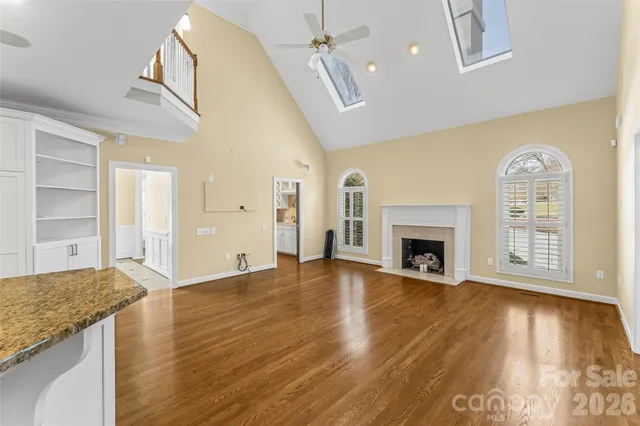 a bathroom with a sink mirror vanity and toilet
