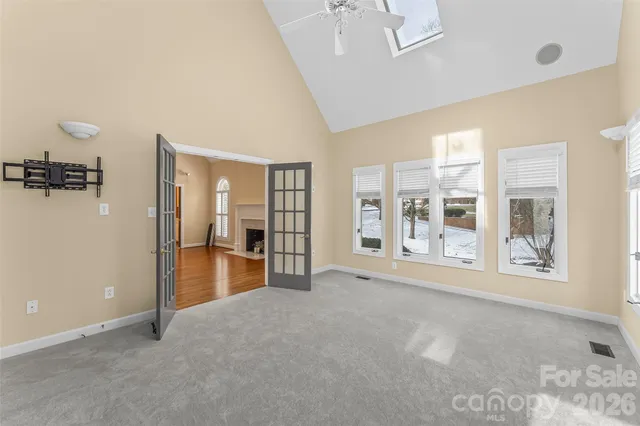 a view of an empty room with a window