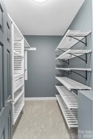 a bathroom with a granite countertop sink a large mirror and a bathtub