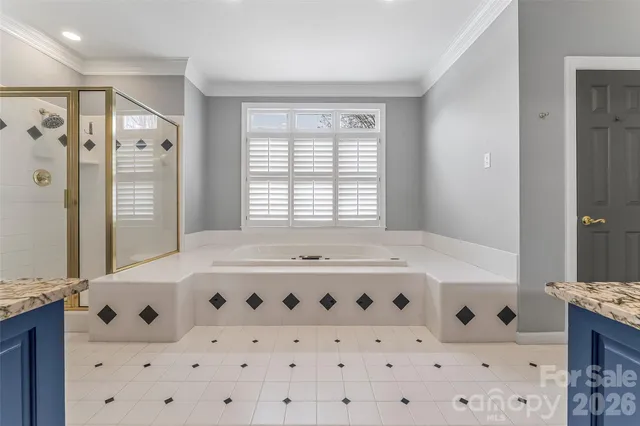 a view of a room with wooden floor staircase and a kitchen